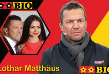 Ein aktuelles Porträt von Lothar Matthäus im Jahr 2026, das den TV-Experten und ehemaligen Fußball-Weltmeister lächelnd zeigt.
