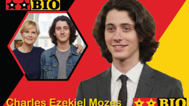 Freigestelltes Frontalbild von Charles Ezekiel Mozes 2026 in Jeansjacke und grauem Shirt für Biografie-Steckbrief.